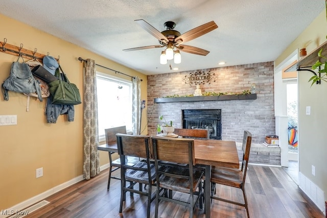 1865 9th St SW, Akron, OH 44314 - dining area with ceiling fan, wood finished floors, and a textured ceiling