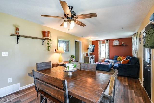 1865 9th St SW, Akron, OH 44314 - dining area with baseboards, a ceiling fan, wood finished floors, and visible vents