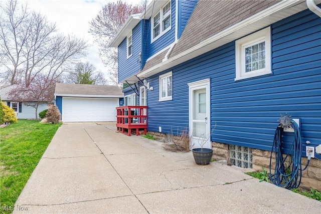 366 Portage St, Wadsworth, OH 44281 - view of side of home featuring an outdoor structure and a detached garage