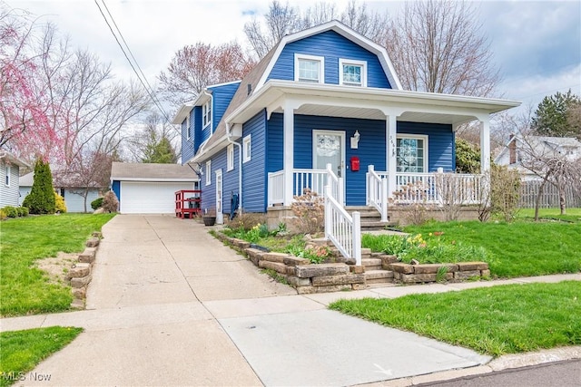 366 Portage St, Wadsworth, OH 44281 - view of front of home with a gambrel roof, a front lawn, a porch, an outbuilding, and a garage