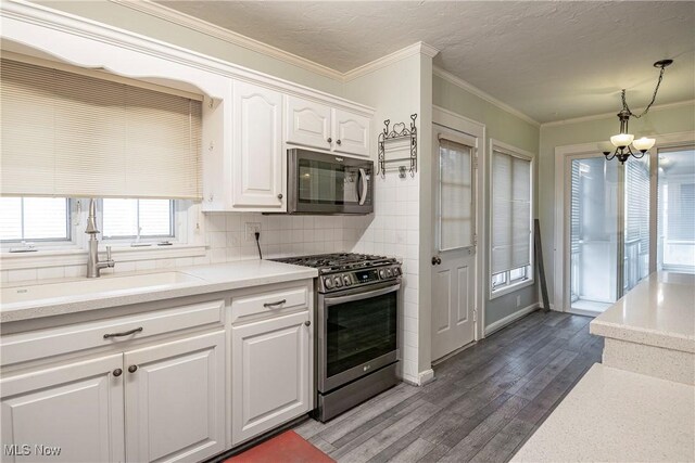 366 Portage St, Wadsworth, OH 44281 - kitchen featuring a sink, dark wood finished floors, an inviting chandelier, white cabinetry, and stainless steel gas stove