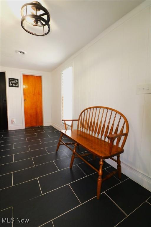 interior space with baseboards and visible vents