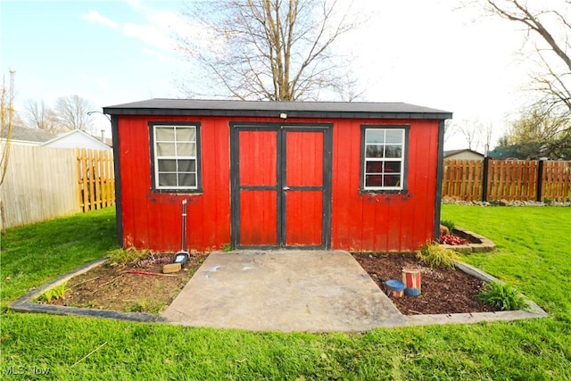view of shed featuring a fenced backyard