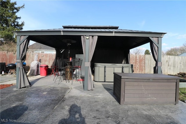 view of patio / terrace featuring fence and a gazebo