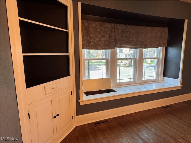 204 N Spring St, Loudonville, OH 44842 - detailed view of baseboards and wood finished floors
