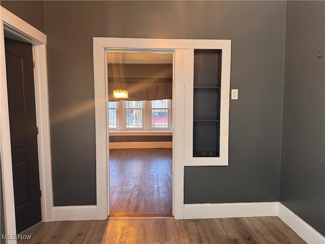 204 N Spring St, Loudonville, OH 44842 - hall with wood finished floors and baseboards