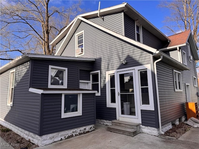 204 N Spring St, Loudonville, OH 44842 - rear view of house with entry steps and cooling unit