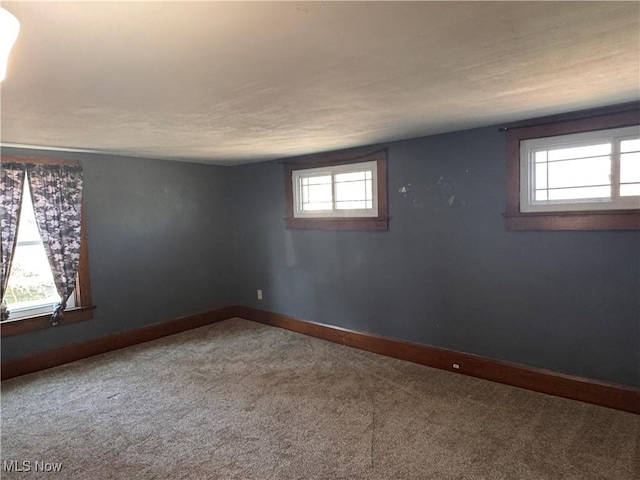 204 N Spring St, Loudonville, OH 44842 - unfurnished room featuring carpet flooring and baseboards