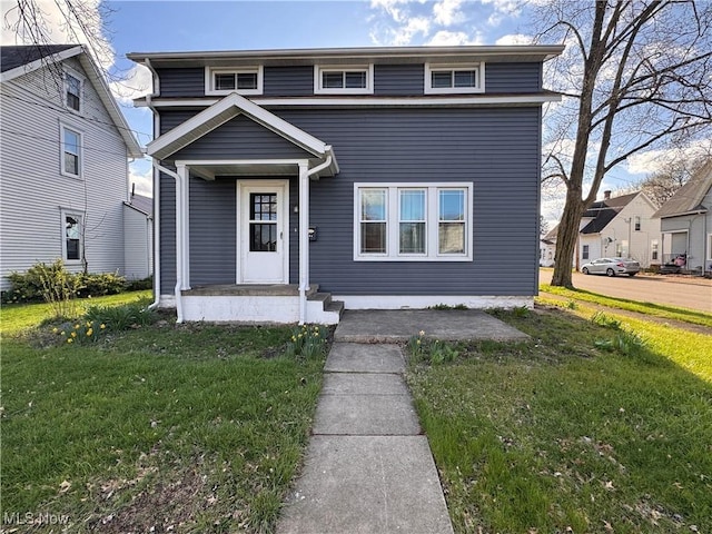 204 N Spring St, Loudonville, OH 44842 - view of front of house featuring a front lawn