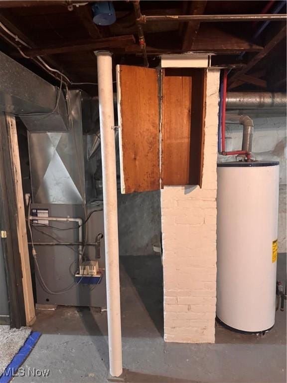 204 N Spring St, Loudonville, OH 44842 - unfinished basement with gas water heater and heating unit