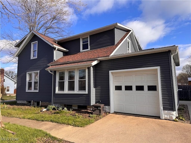 204 N Spring St, Loudonville, OH 44842 - view of front of house featuring a garage, driveway, and roof with shingles
