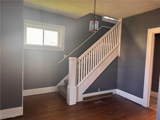204 N Spring St, Loudonville, OH 44842 - stairs featuring wood finished floors and baseboards