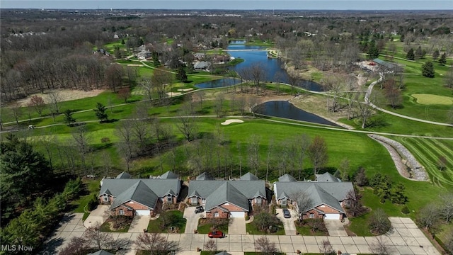 aerial view featuring golf course view, a water view, and a residential view
