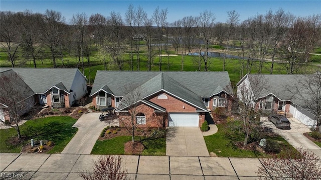 birds eye view of property featuring a residential view and a water view