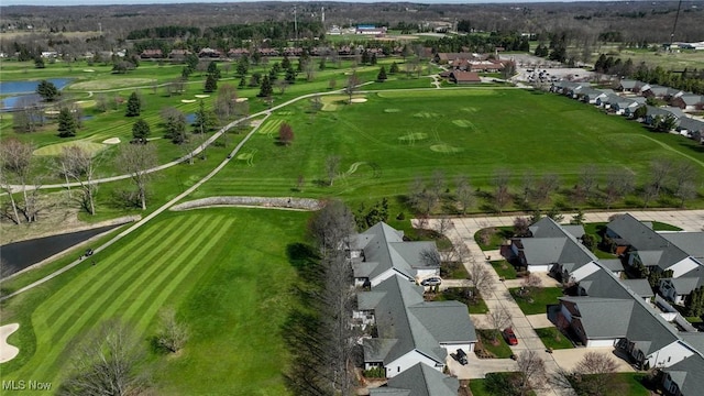 bird's eye view featuring view of golf course, a residential view, and a water view