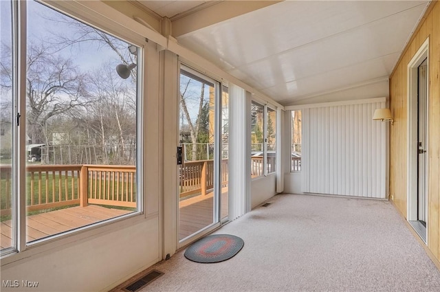 unfurnished sunroom with visible vents and a healthy amount of sunlight