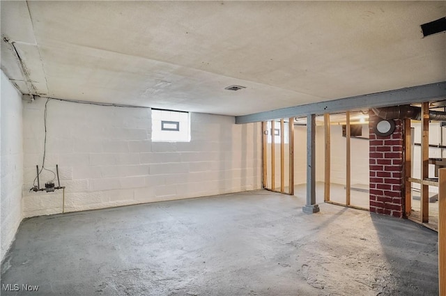 below grade area with concrete block wall