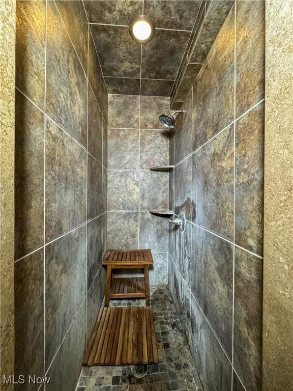 details with a tile shower