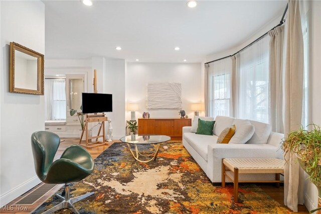 1881 W 65th St, Cleveland, OH 44102 - living area with healthy amount of natural light, baseboards, recessed lighting, and wood finished floors