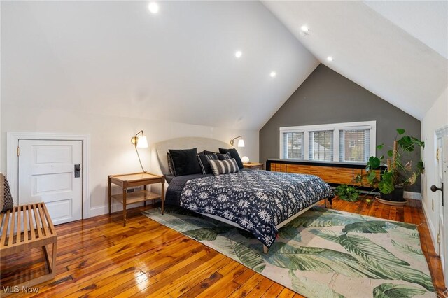 1881 W 65th St, Cleveland, OH 44102 - bedroom with wood-type flooring, vaulted ceiling, baseboards, and recessed lighting