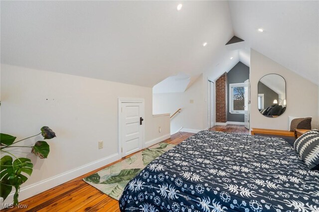 1881 W 65th St, Cleveland, OH 44102 - bedroom featuring wood finished floors, lofted ceiling, baseboards, and recessed lighting