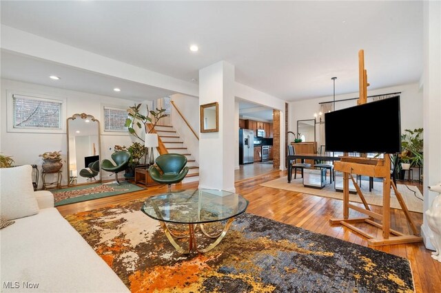 1881 W 65th St, Cleveland, OH 44102 - living area featuring wood finished floors, stairs, and recessed lighting