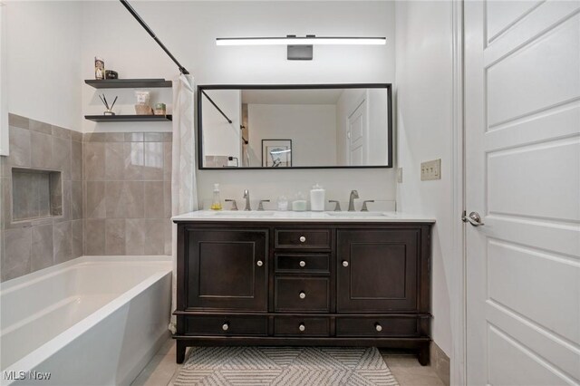 1881 W 65th St, Cleveland, OH 44102 - full bathroom with tile patterned floors, double vanity, and shower / washtub combination