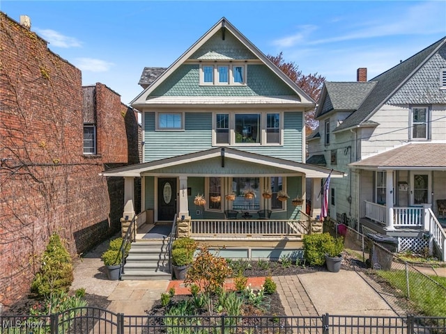 1881 W 65th St, Cleveland, OH 44102 - view of front of property featuring covered porch, a fenced front yard, a gate, and stairway