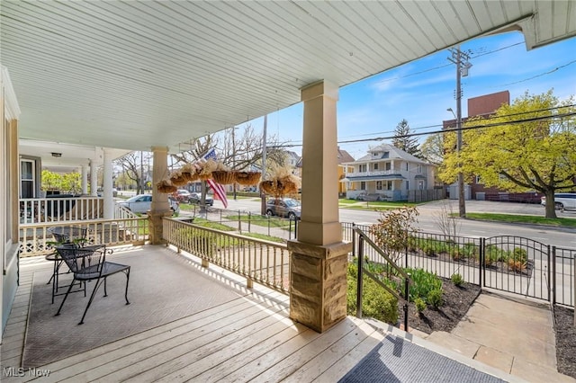 1881 W 65th St, Cleveland, OH 44102 - wooden porch with a residential view
