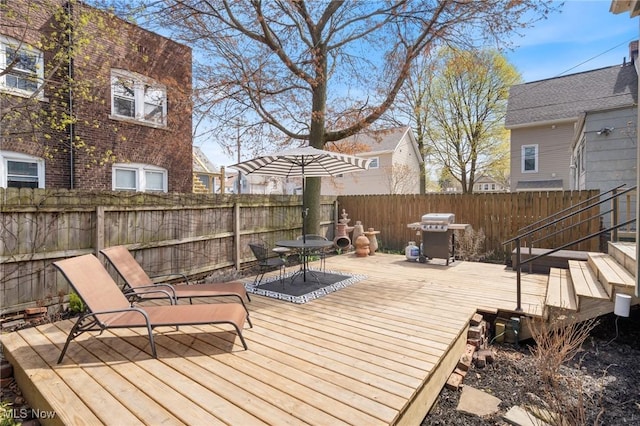 1881 W 65th St, Cleveland, OH 44102 - wooden terrace featuring a fenced backyard, grilling area, and outdoor dining space