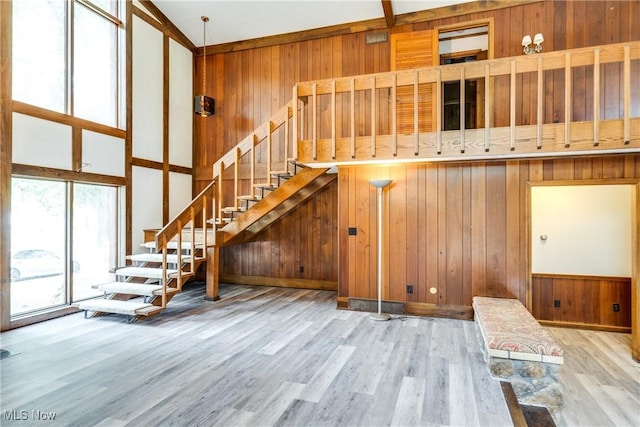 1809 Heritage Cir, Dover, OH 44622 - interior space with stairway, wood finished floors, and wooden walls