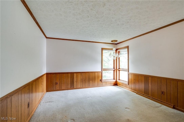 1809 Heritage Cir, Dover, OH 44622 - spare room with crown molding, a textured ceiling, a wainscoted wall, and wood walls