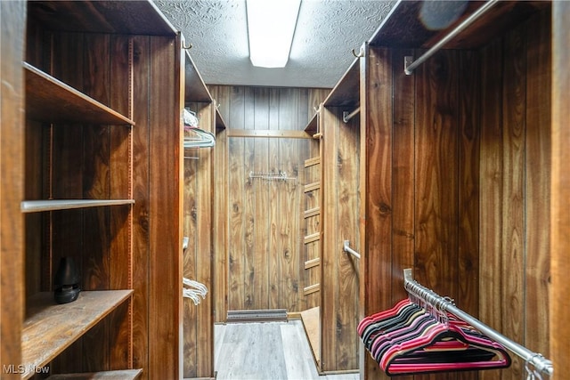 1809 Heritage Cir, Dover, OH 44622 - walk in closet featuring wood finished floors