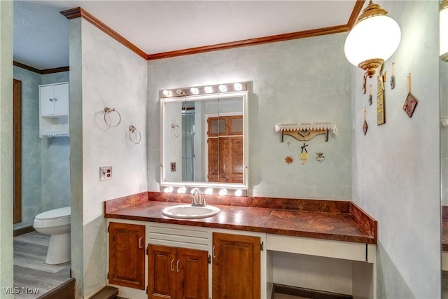 1809 Heritage Cir, Dover, OH 44622 - bathroom with toilet, vanity, and ornamental molding
