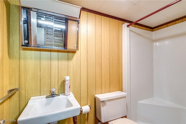 1809 Heritage Cir, Dover, OH 44622 - bathroom with walk in shower, wood walls, a sink, and toilet