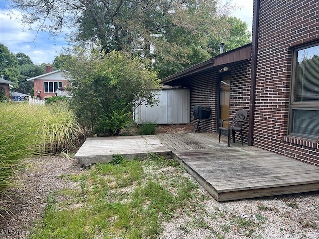 1809 Heritage Cir, Dover, OH 44622 - wooden terrace with a storage shed and an outdoor structure
