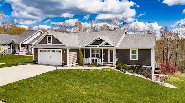 craftsman house with concrete driveway, an attached garage, a front lawn, and covered porch