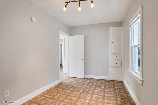 3533 Carlyle Ave, Cleveland, OH 44109 - spare room featuring baseboards