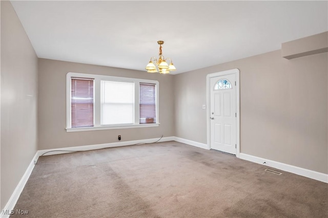 3533 Carlyle Ave, Cleveland, OH 44109 - carpeted spare room with visible vents, baseboards, and a chandelier