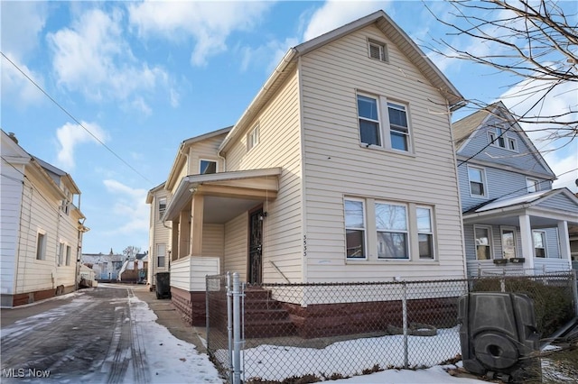 3533 Carlyle Ave, Cleveland, OH 44109 - snow covered property with fence private yard