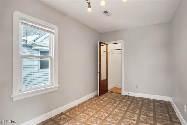 3533 Carlyle Ave, Cleveland, OH 44109 - unfurnished room featuring baseboards and visible vents