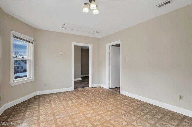 3533 Carlyle Ave, Cleveland, OH 44109 - empty room featuring baseboards, visible vents, and rail lighting