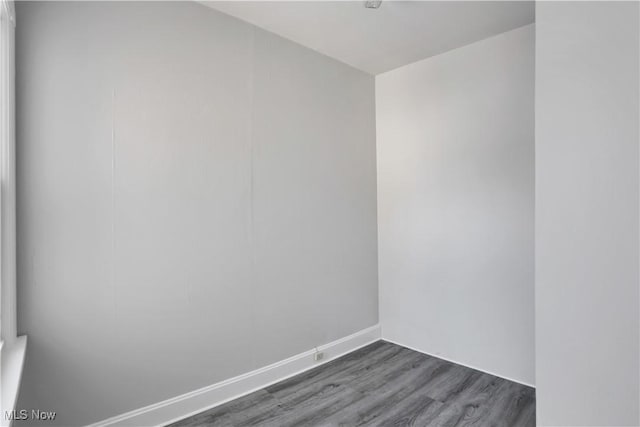 3533 Carlyle Ave, Cleveland, OH 44109 - empty room featuring baseboards and dark wood-style floors
