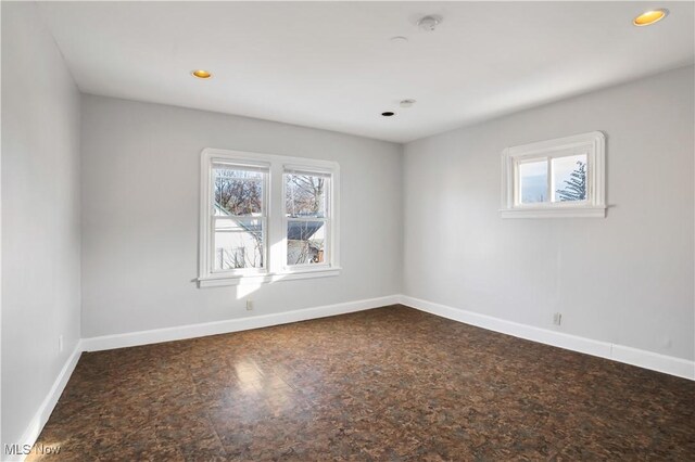 3533 Carlyle Ave, Cleveland, OH 44109 - empty room featuring plenty of natural light, baseboards, and recessed lighting
