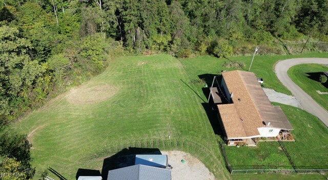 drone / aerial view with a view of trees