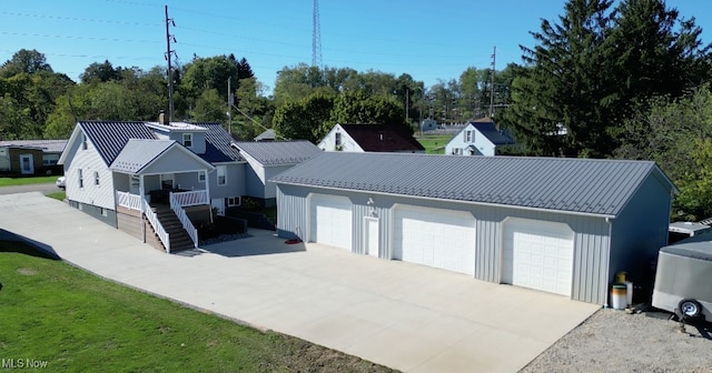 exterior space with a detached garage