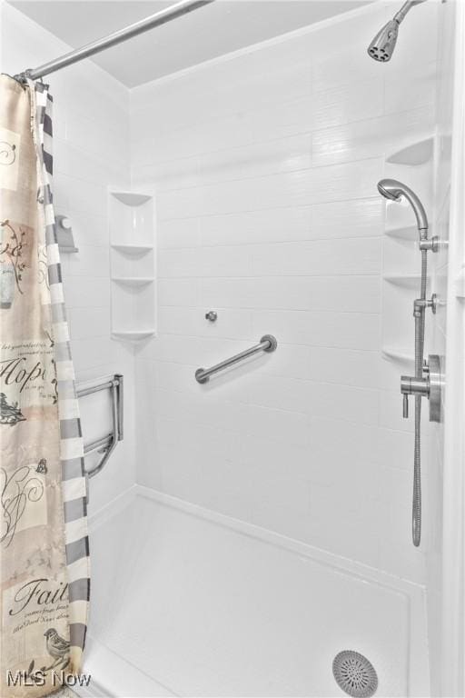 bathroom with a stall shower