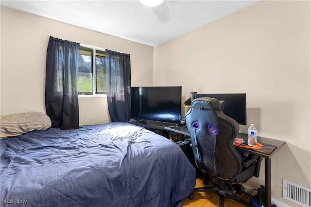 bedroom featuring ceiling fan and visible vents