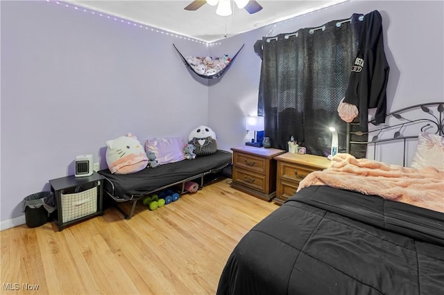 bedroom with light wood-style flooring and ceiling fan