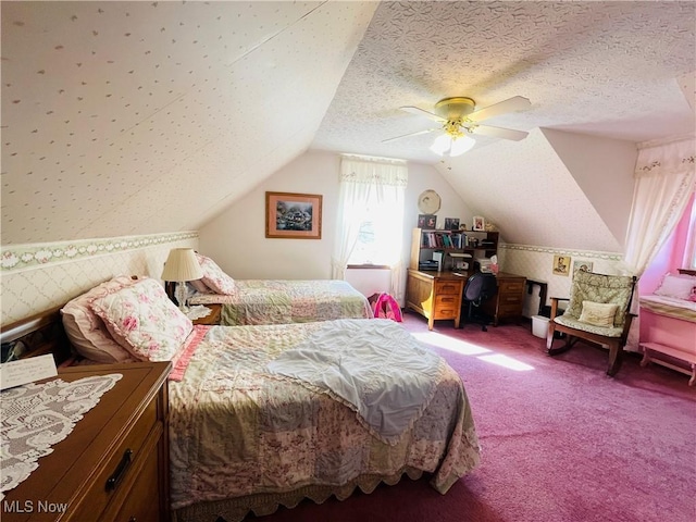 bedroom featuring vaulted ceiling, ceiling fan, carpet floors, and a textured ceiling